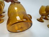 a person that is putting a coin in a glass
