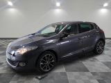 a grey car is parked in a room with a checkered floor