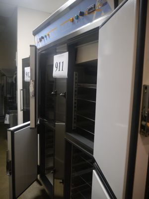 a refrigerator with a door open in a room