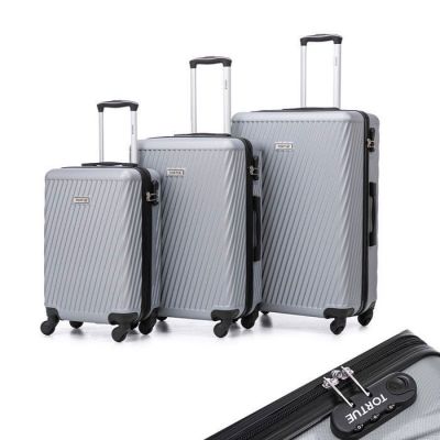 three pieces of luggage sitting next to each other on a white surface