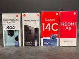 three boxes of redmi note 4c and redmi note 4c next to each other