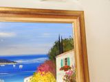 a picture of a painting hanging on the wall of a house
