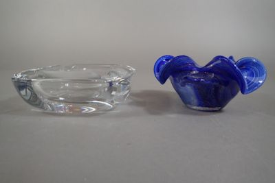 two glass bowls sitting next to each other on a table