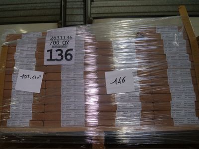 a pallet full of boxes of boxes with price tags on them