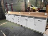 a white cabinet with drawers and drawers in a warehouse