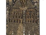 an old wooden plaque with carvings on it on a white background