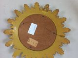 a yellow sunburst on a white table with a tag on it