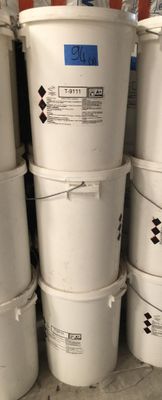 several white buckets stacked on top of each other in a room