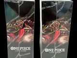 two boxes of one piece card game cards with a picture of a man on a horse
