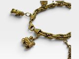a close up of a gold bracelet with charms on a white background