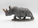 figurine of a rhinocer on a white background