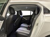 a white car with black seats in the back of it