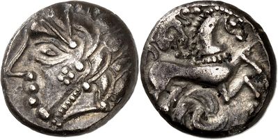 a silver coin with an image of a dragon on it