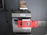 une image représentant une machine surmontée d'une boîte