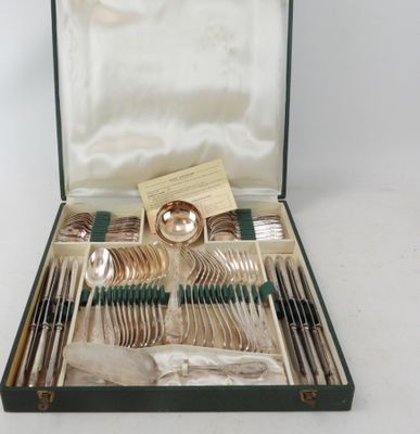 a case with silverware in it on a white surface