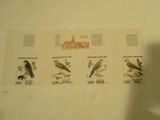 a picture of a collection of stamps with birds on them