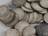 a pile of coins sitting on top of a table