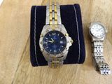 a watch and a watch bracelet sitting on a table