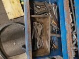 a box full of tools sitting on the floor