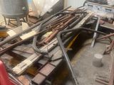 a pile of tools sitting on the floor in the garage