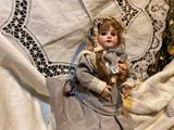 a small doll that is sitting on a table