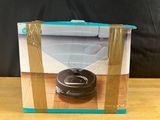 an image of a box with a donut in it sitting on a table