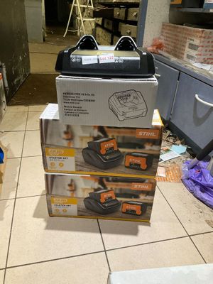 a stack of boxes sitting on the floor in the kitchen