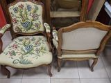 two chairs sitting next to each other in a room