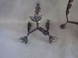 two metal birds that are sitting on a table