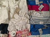 a lot of clothes that are in a suitcase