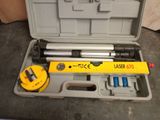 an image of a tool box with a laser level and a tool in it