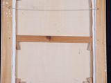 painting of a wooden easel with a canvas on a black background