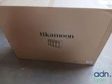 a box that is sitting on the floor in front of a window