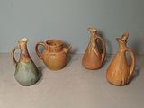 five different types of vases sitting on a table