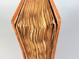 an image of a wooden box with a book inside of it