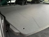 the back of a car with the seat folded down and the back of the seat folded down