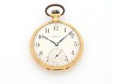 pocket watch on a white surface with a white background