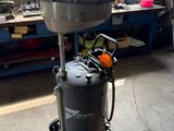 a machine that is sitting on a cart in a garage