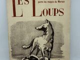 un vieux livre avec le dessin d'un chien sur la couverture