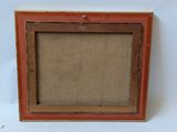 an old picture frame with a piece of linen in it