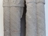two pieces of stone that are sitting on a white surface