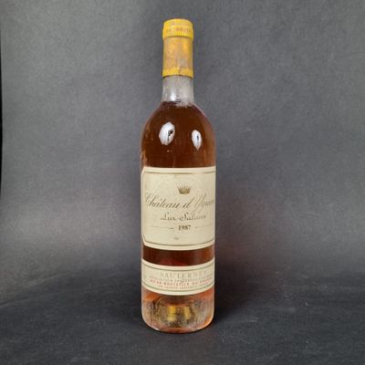an image of a bottle of wine sitting on top of a table
