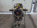 a small machine that is sitting on the ground