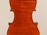 an antique violin with a wooden back and bow