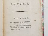 a book open on a white surface with a red border