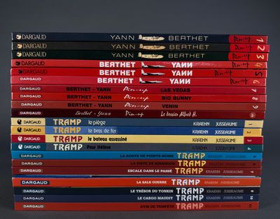 many books stacked on top of each other on a table