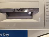 la façade d'une machine à laver sur laquelle est inscrit « Bosch Dry »