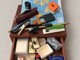 a suitcase with a map and other items in it
