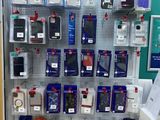 a display of cell phones on the wall in a store