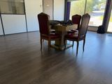 a dining room with a table and four chairs in it